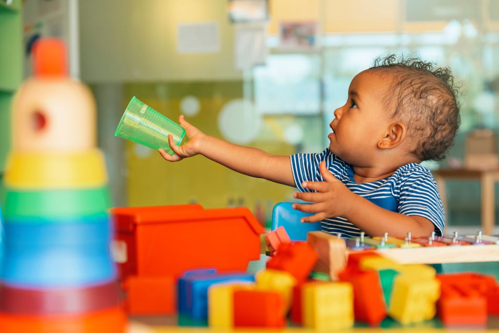 baby learning to share at day care